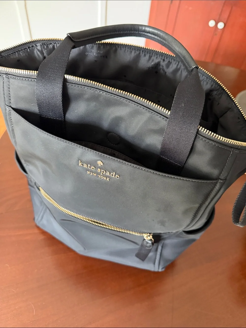 kate spade black nylon backpack with gold hardware